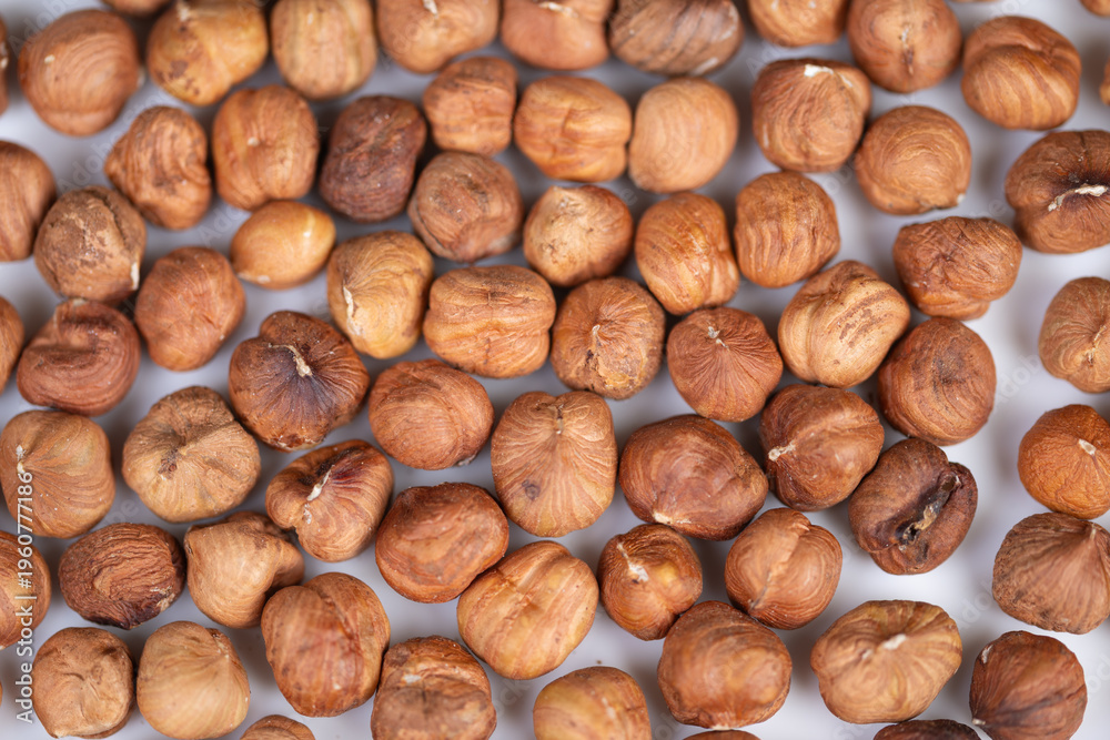 Fototapeta premium Elegant arrangement of natural hazelnuts emphasizing artistic texture and style. Stylistic presentation of rustic hazelnuts with matte finishes in artistic culinary display