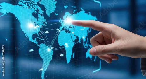 Professional hand pointing at global shipping route on interface, logistics business, blue blurred setting, stock style.