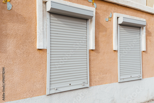 Rolling shutters on a building in a residential area during the day