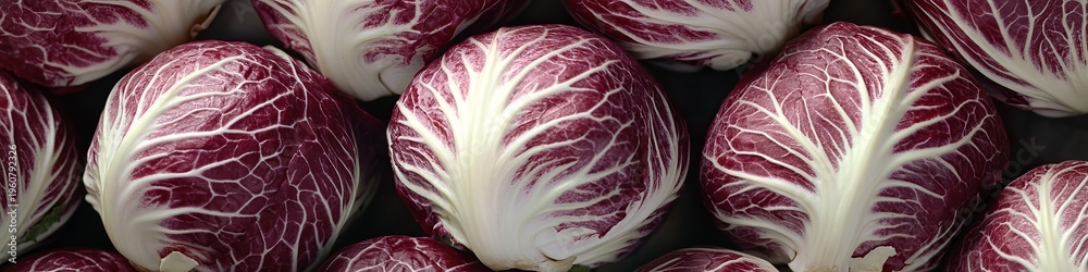 Obraz premium Close Up of Fresh Crimson Radicchio Heads with Detailed Veined Leaves and Layered Textures in 4K