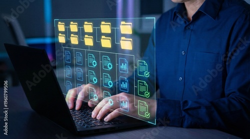 Programmer working on notebook PC with holographic interface displaying organized folders and digital files representing automated data archiving and workflow tracking.