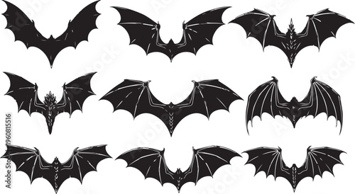 Collection of black bat silhouettes in various flying positions