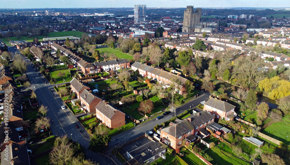 Fototapeta premium Aerial View of Suburban Neighborhoods with Red Brick Houses and Green Trees