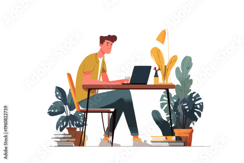 Young caucasian male working at desk with laptop and books