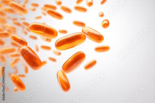 falling soaring orange medicine capsules on white background