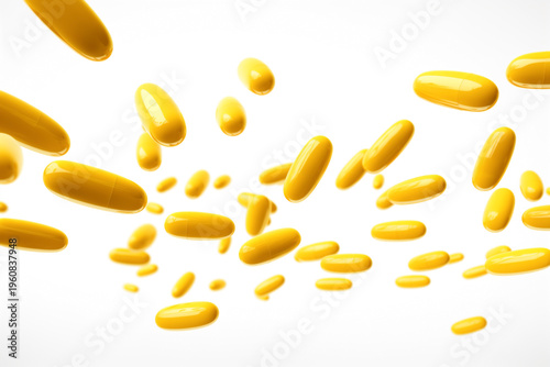 falling soaring yellow medicine capsules on white background