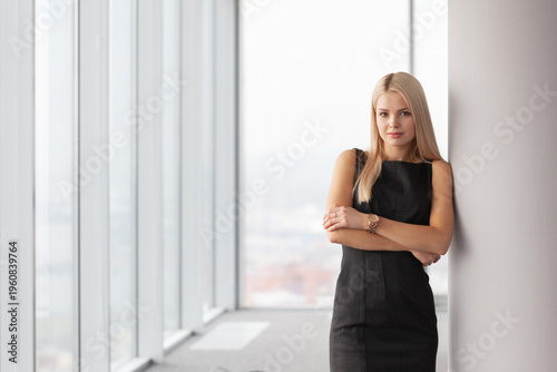 A successful businesswoman stands in the office Free Download A successful businesswoman stands in the office - GFXLoad