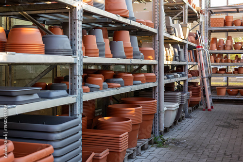 Tablou pe pânză Retail store aisle featuring racks stocked with a wide variety of new gardening