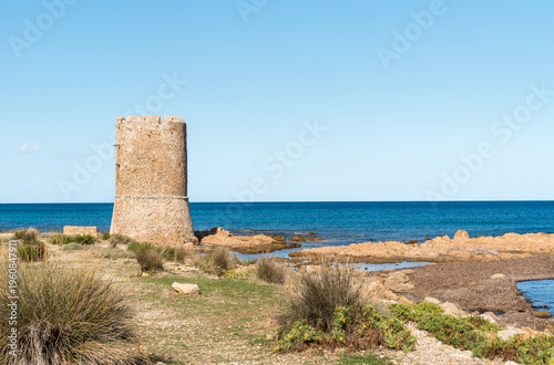 Wallpaper Mural The Tower of San Giovanni located in Posada, Sardinia, Italy. Historic coastal watchtower overlooking the Mediterranean Sea and surrounding landscape. Torontodigital.ca
