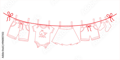 Baby clothes hanging on a clothesline