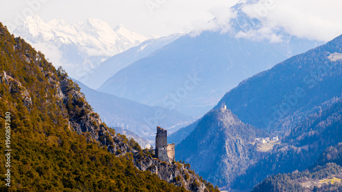 castle ruin schrofenstein and the tyrol landscape in spring