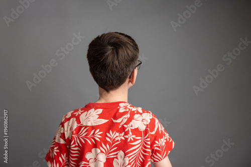 Photography Boy seen from behind isolated on grey background studio portrait