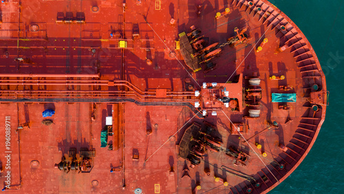 Fotografie Massive oil tanker ship at maritime loading terminal for global energy logistics and petroleum freight transport