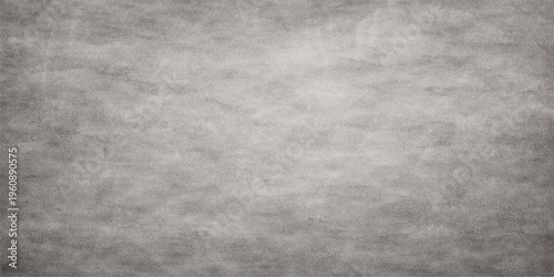 A dark vintage grey grunge paper texture with an aged rough surface pattern and black and white concrete wall design for an old textured backdrop