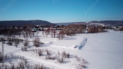 Flight over a winter village
