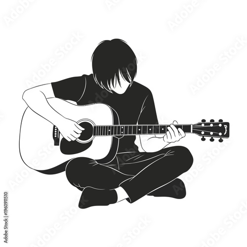 Young man playing acoustic guitar sitting.