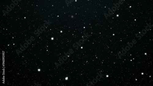 Vibrant multicolored lines and dots swirl in abstract motion against a dark background with glowing streaks of light.