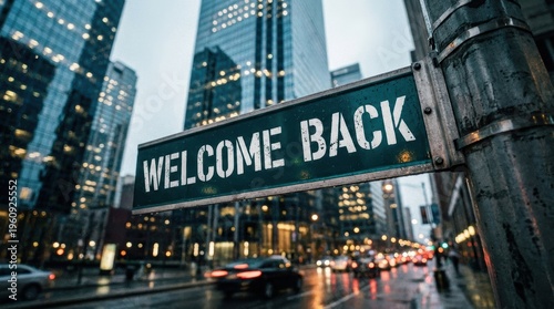 Welcome Back Sign Amidst Busy Urban Street with Skyscrapers and Raindrops in City
