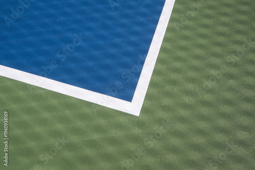 Sunlight Shines Throught the Net on a Pickleball Court Creating a Beautiful Pattern