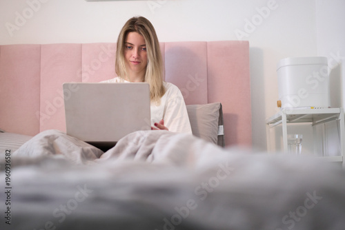 Morning Laptop Session in a Cozy Bedroom