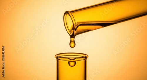 Vibrant yellow test tube elegantly drips luminous golden liquid, symbolizing lab research and development, presented in commercial photography