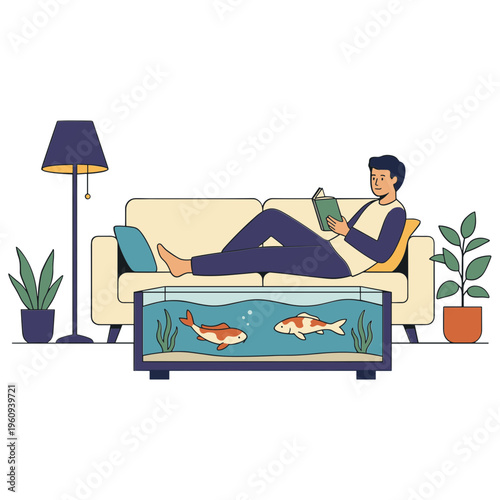 A man sits on a couch reading a book next to plants and a lamp with a fish tank in front.