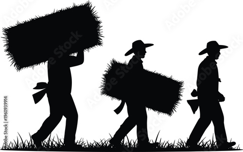 Three farmers walking in silhouette through a rural field carrying hay bales for livestock feed during the agricultural summer harvest period.