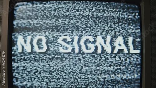 A static television screen displays the message NO SIGNAL.