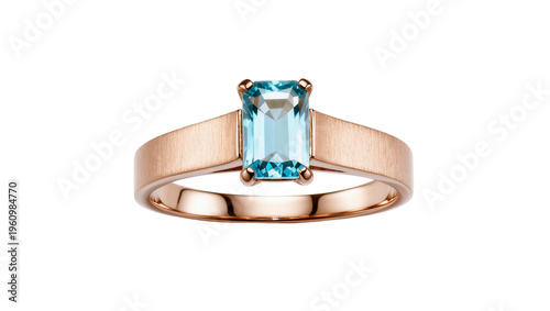 Canvastavla Isolated elegant rose gold ring featuring a sparkling emerald cut blue gemstone