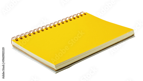 Tableau sur toile Isolated yellow spiral-bound notebook laying angled, perfect for school supplies