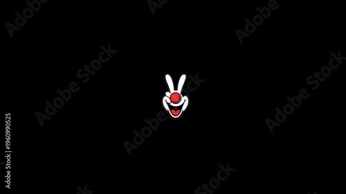 Playful cartoon happy face with a big smile, red nose, and white pointy ears on a black background, cheerful character graphic.