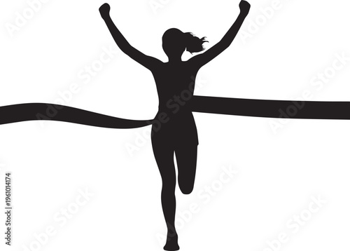 A triumphant woman crosses the finish line with her arms raised in victory