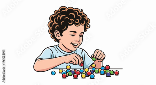 Joyful boy with curly hair plays with colorful marbles on a white background
