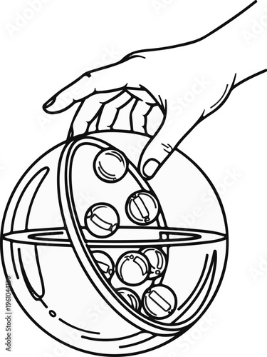 Hand holding clear sphere with marbles, selecting one