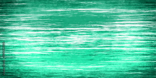 An abstract grunge background of deep aqua ripples across a clear ocean surface where green waves meet the blue sea under a summer sky reflection