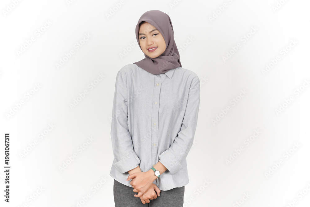Fototapeta premium Beautiful Asian Muslim Woman Smiling Standing Over White Background