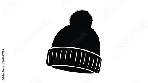 Winter fashion black beanie hat with white accents and pom pom on top, isolated on white background