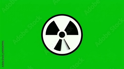 Black and white radiation hazard symbol on a vibrant green background