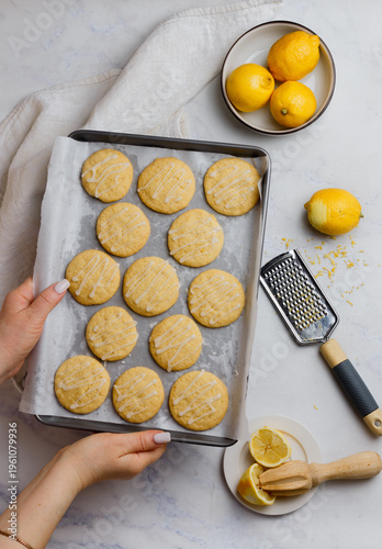 Freshly baked lemon cookies with icing sugar. Fresh homemade pastry. Selective focus