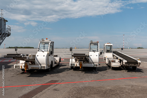 Empty self-propelled conveyor baggage belt loaders at the airport