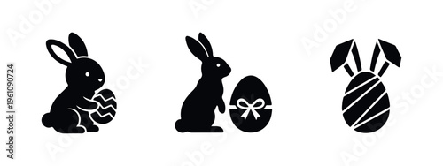 Set of black Easter bunny and egg silhouettes on a white background. Minimalist icons featuring rabbits with decorated Easter eggs.