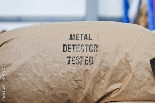 Stacked Industrial Paper Sacks with Metal Detector Tested Quality Control Stamp
