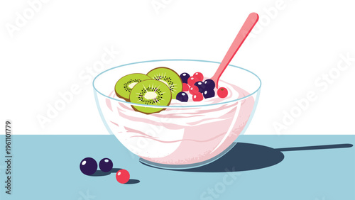 Delicious bowl of pink yogurt topped with fresh kiwi slices, blueberries, and raspberries with a spoon and blue table.