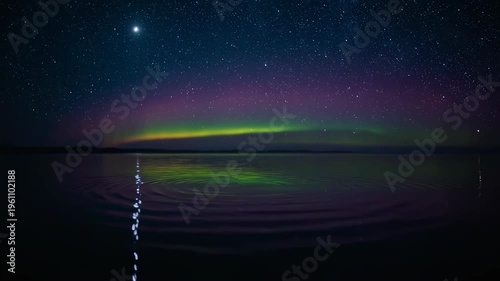 Night sky filled with stars and clouds over a dark landscape