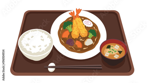 Traditional Japanese meal tray featuring shrimp tempura curry with vegetables, a bowl of steamed rice, miso soup, and wooden chopsticks.