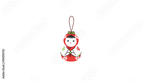 Cute traditional Japanese doll ornament in a red and white floral kimono hanging from a brown string on a white background.