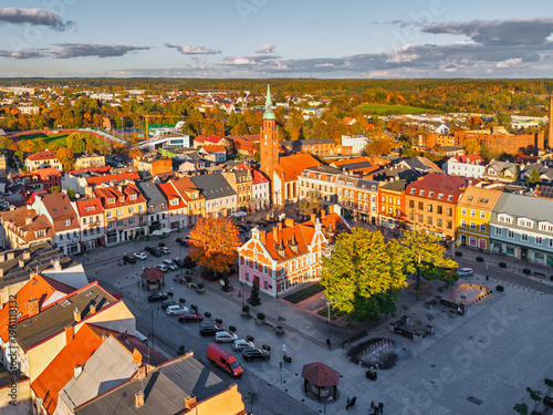 The market square in Starogard Gdanski in the light of the setting sun at autumn. Poland