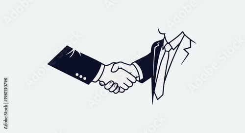 Two individuals in formal attire share a handshake