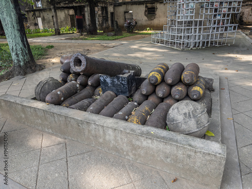 Obraz na płótnie Historic cannon, cannonballs, and stacked artillery shells displayed at Fort Santiago, Intramuros, Manila