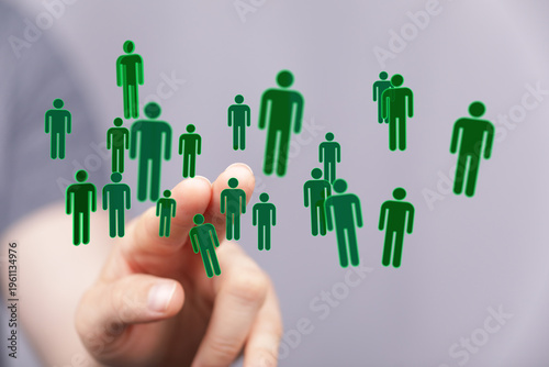 Hand touching digital peopl...